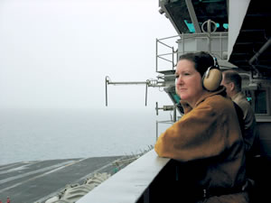 Los Angeles Times reporter Carol Williams, '77, watches flight operations aboard the U.S.S. Abraham Lincoln during the Iraq war. Photo courtesy Carol Williams.