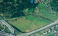 This 1997 aerial view shows the Richard Truly Farm in Bothell that would become home to UW Bothell and Cascadia Community College. The cow pasture at the bottom would be turned into wetlands.