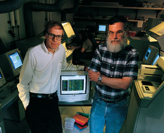 UW scientists Maynard Olson (left) and Philip Green stand in a genetics research lab in Fluke Hall. The two take a dim view of the commercial side of human genetics research done be Celera Genomics Group, Inc. Photo by Kathy Sauber.